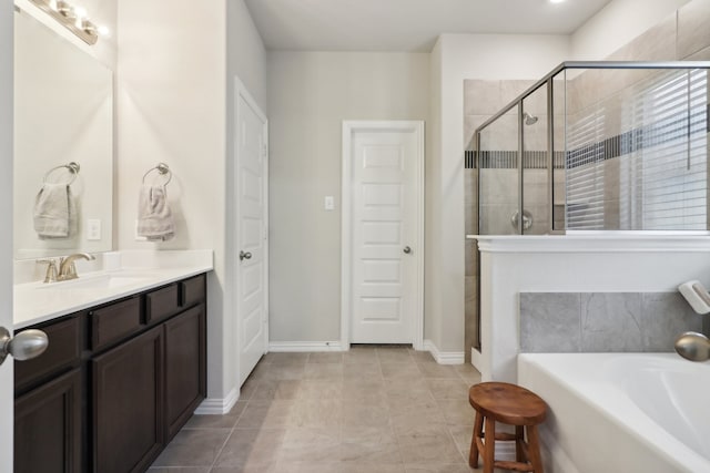 bathroom featuring vanity, separate shower and tub, and tile patterned floors