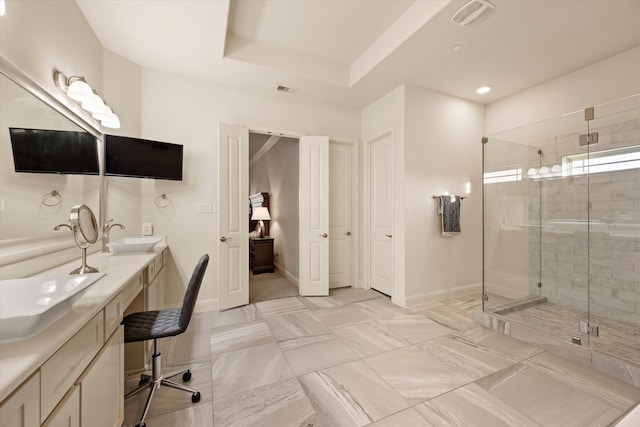 bathroom featuring vanity and a shower with shower door