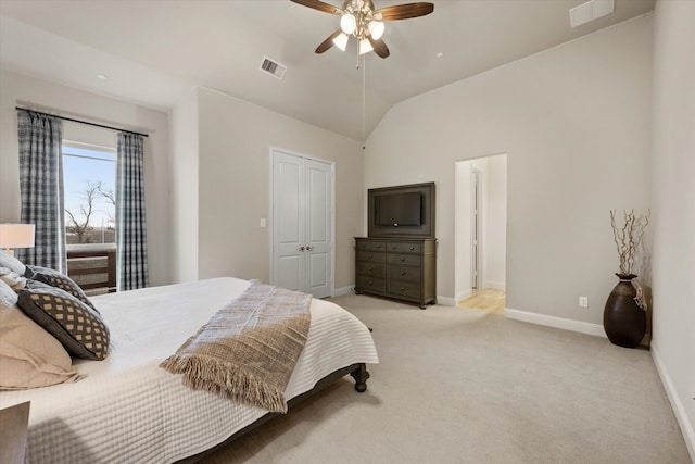 carpeted bedroom with lofted ceiling and ceiling fan