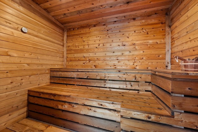 view of sauna / steam room with wood ceiling and wood walls