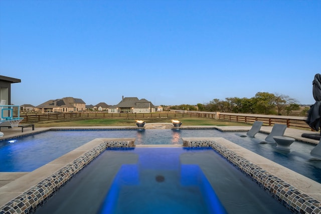 view of swimming pool with a jacuzzi and pool water feature