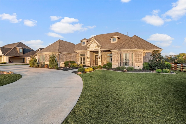 view of front of home featuring a front yard and a garage