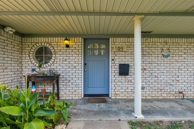 property entrance with a porch