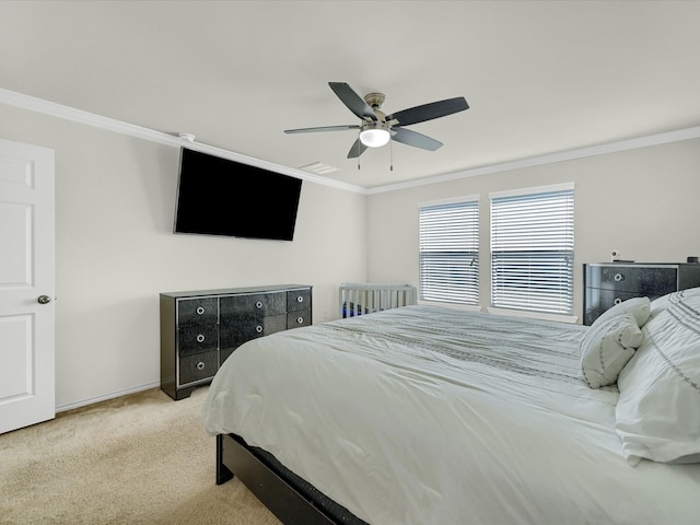 bedroom with ornamental molding, light carpet, and ceiling fan