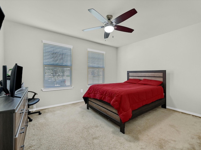 bedroom with light carpet and ceiling fan