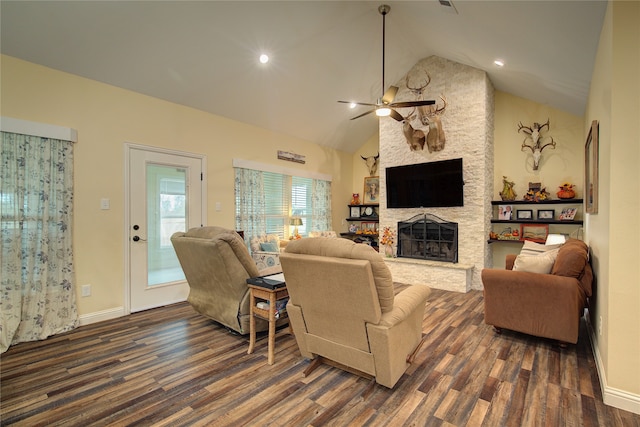 living room featuring a stone fireplace, dark hardwood / wood-style floors, high vaulted ceiling, and ceiling fan