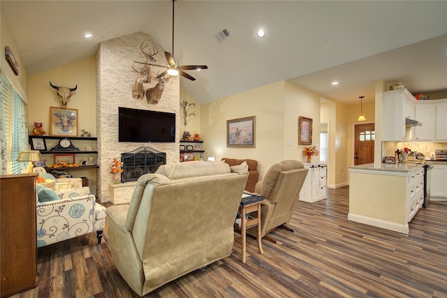 living room featuring dark wood-type flooring, a fireplace, high vaulted ceiling, and ceiling fan