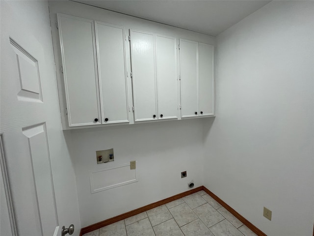 clothes washing area featuring hookup for a washing machine, electric dryer hookup, and cabinets