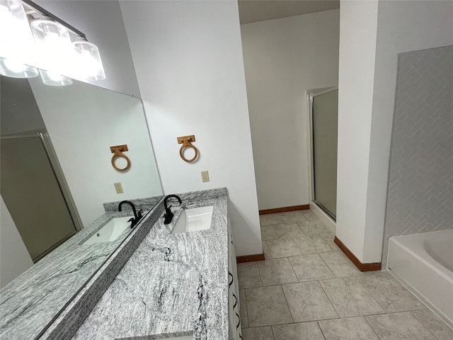 bathroom with vanity, independent shower and bath, and tile patterned flooring