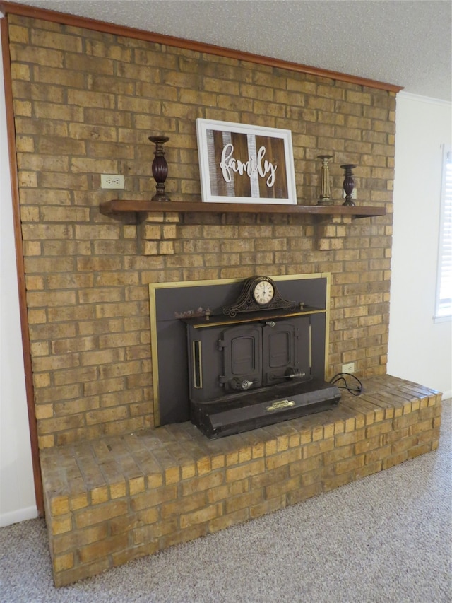 room details with carpet, crown molding, a textured ceiling, and a wood stove