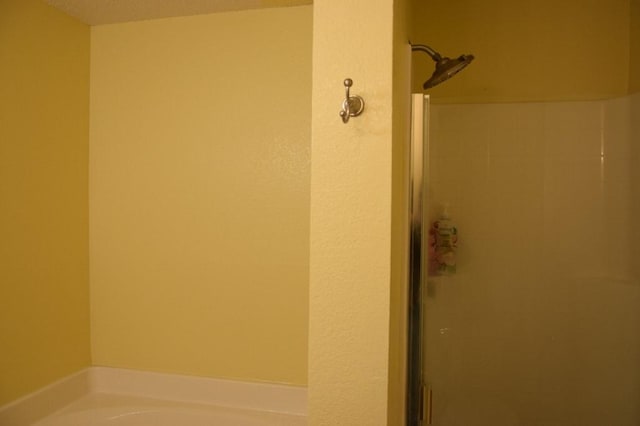 bathroom with separate shower and tub