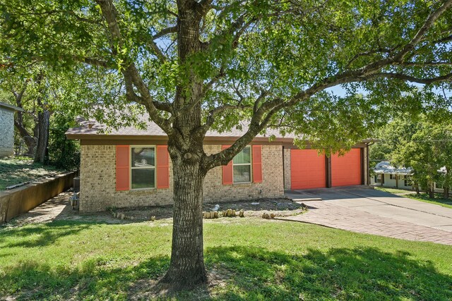 ranch-style house with a front lawn and a garage