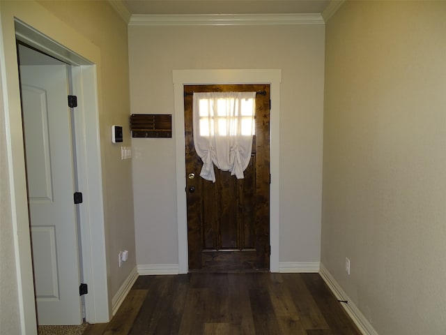 doorway to outside with ornamental molding and dark hardwood / wood-style floors