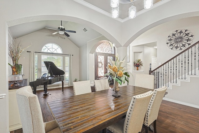 dining space with crown molding, ceiling fan, dark hardwood / wood-style flooring, and vaulted ceiling