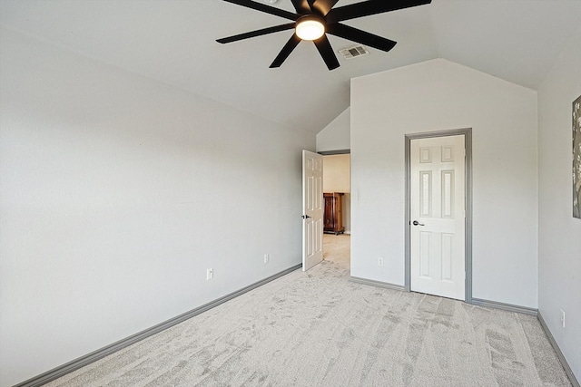 unfurnished bedroom with light carpet, vaulted ceiling, and ceiling fan