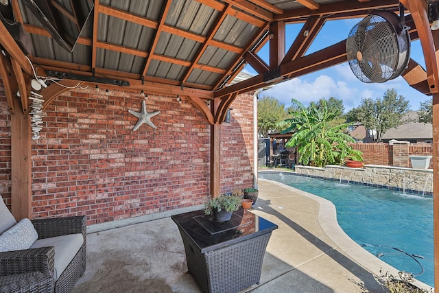 view of swimming pool featuring a patio and pool water feature