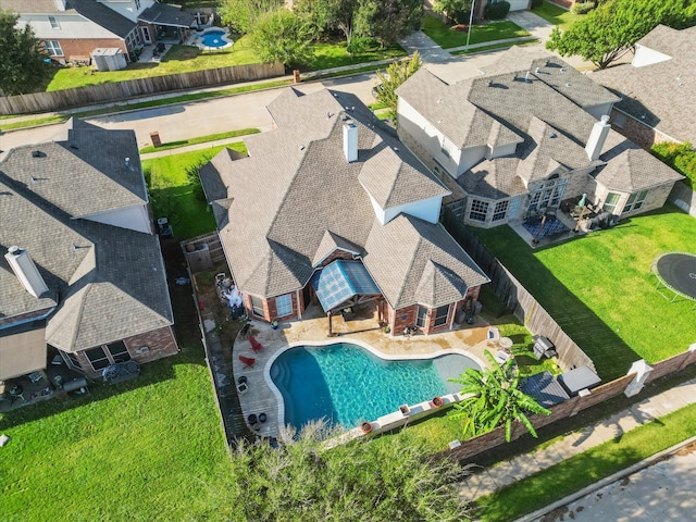 birds eye view of property with a residential view