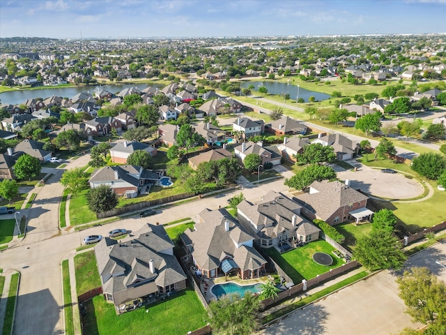 bird's eye view with a residential view and a water view