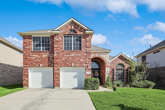 traditional home featuring a front yard, an attached garage, brick siding, and driveway