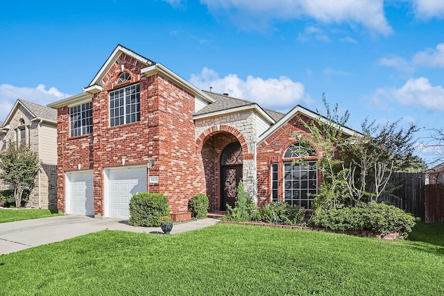 traditional-style house featuring brick siding, a front lawn, fence, concrete driveway, and an attached garage