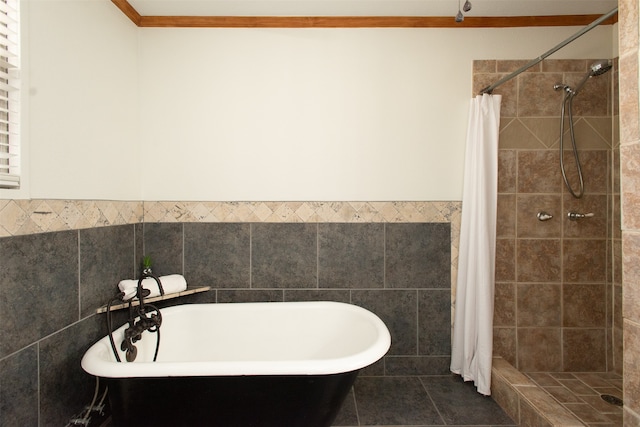 bathroom with shower with separate bathtub, tile walls, and ornamental molding