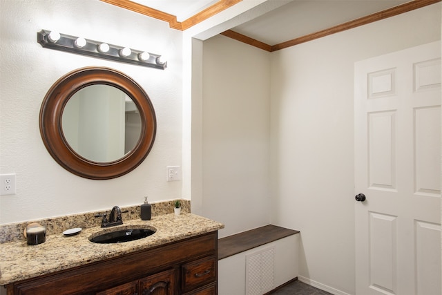 bathroom with vanity and ornamental molding