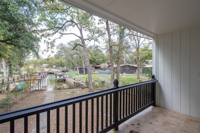 balcony featuring a water view