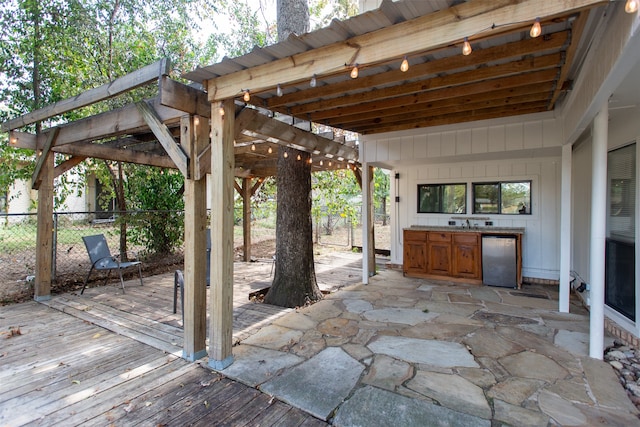 view of patio / terrace with area for grilling and a wooden deck