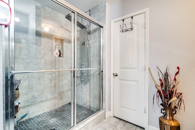 bathroom featuring tile patterned floors and walk in shower