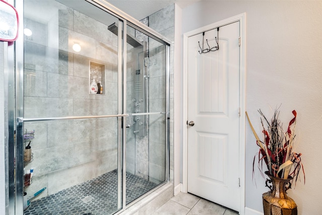 2209 Torch Lake Dr, Forney, TX 75126 - bathroom with a shower stall and tile patterned flooring