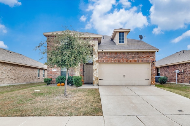 2209 Torch Lake Dr, Forney, TX 75126 - view of front of home featuring an attached garage, a front yard, driveway, and brick siding