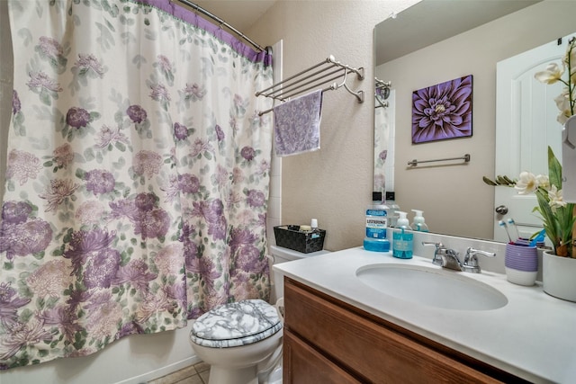 2209 Torch Lake Dr, Forney, TX 75126 - bathroom featuring a textured wall, tile patterned flooring, shower / bath combo, vanity, and toilet