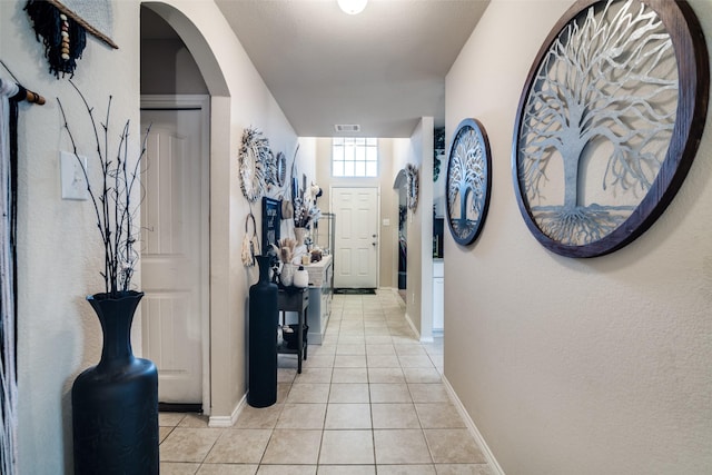 2209 Torch Lake Dr, Forney, TX 75126 - hall featuring baseboards, light tile patterned flooring, and visible vents