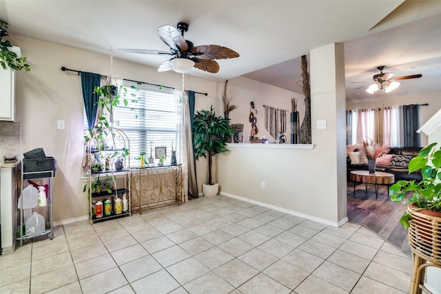 interior space featuring ceiling fan