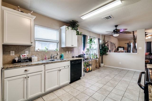 kitchen with sink, dishwasher, white cabinetry, and a healthy amount of sunlight