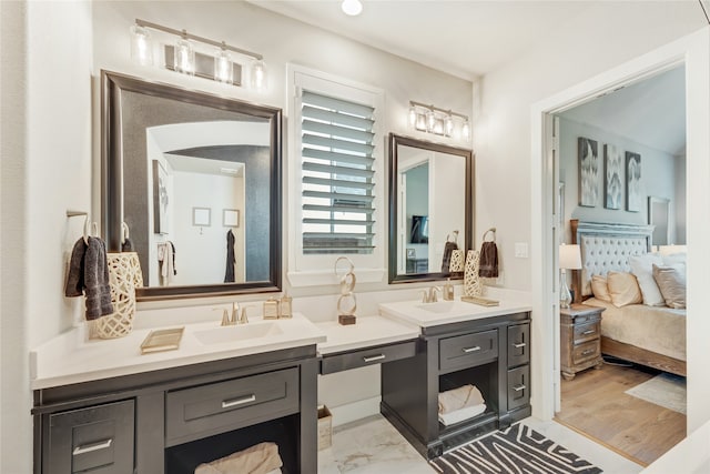 bathroom featuring hardwood / wood-style floors and vanity