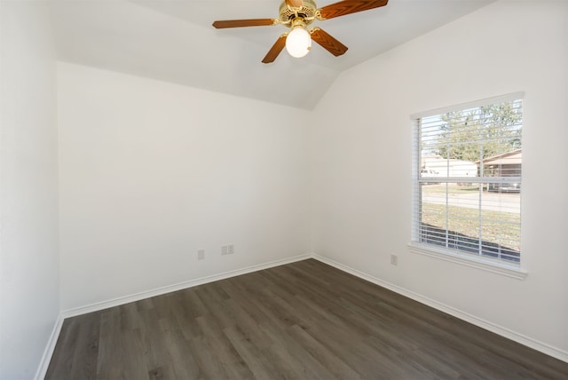 unfurnished room with ceiling fan, vaulted ceiling, and dark hardwood / wood-style floors