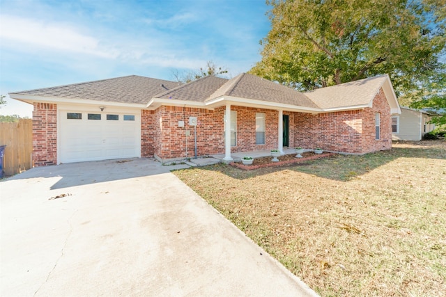 ranch-style home with a front lawn and a garage