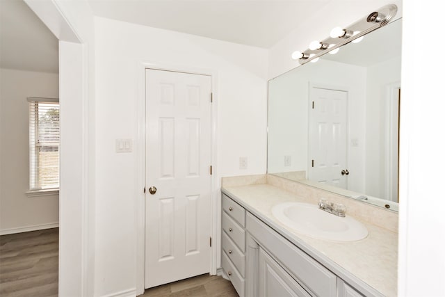 bathroom with vanity and hardwood / wood-style floors