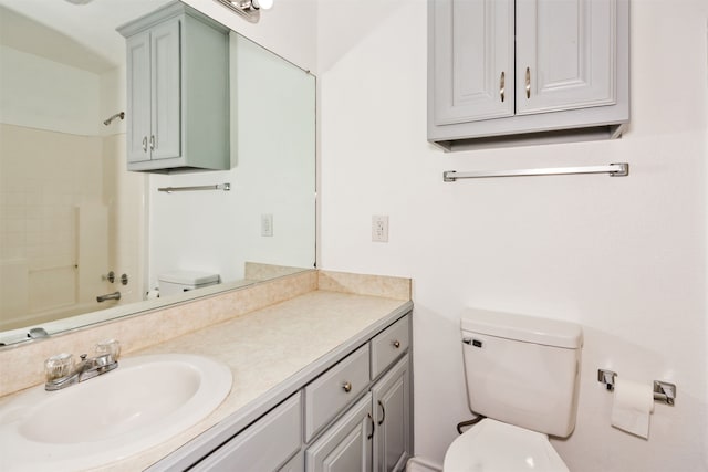 full bathroom featuring toilet, vanity, and bathing tub / shower combination