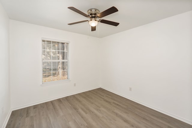 unfurnished room with wood-type flooring and ceiling fan