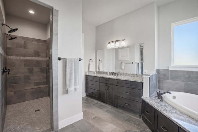 bathroom with vanity and plus walk in shower