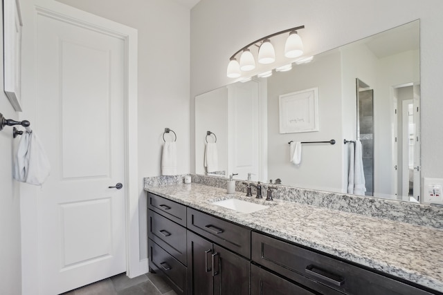 bathroom featuring tile patterned flooring and vanity