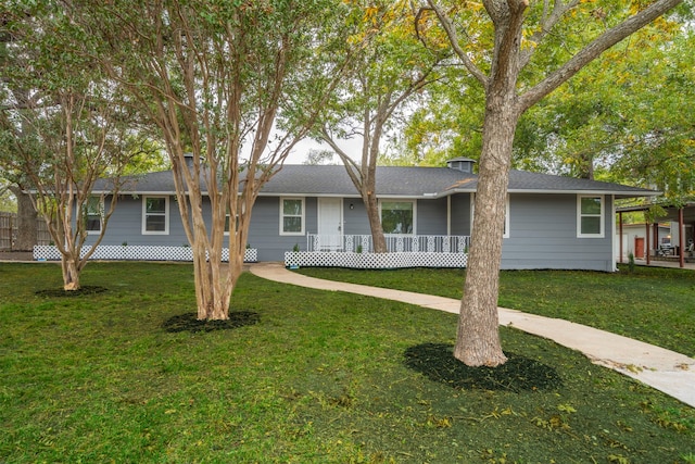 single story home with a porch and a front yard