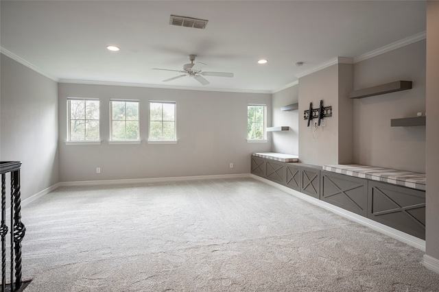 interior space with crown molding and ceiling fan