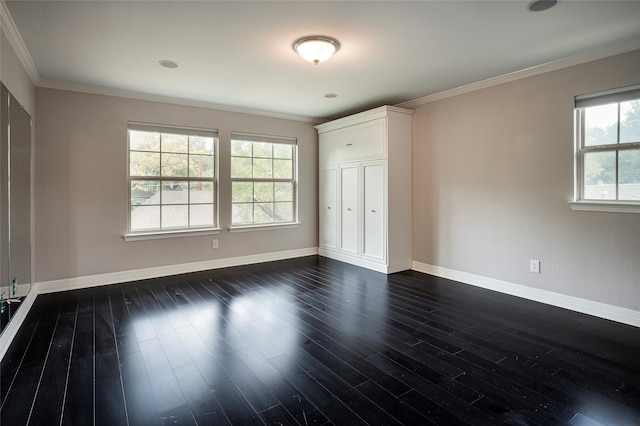 unfurnished bedroom with multiple windows, ornamental molding, and dark hardwood / wood-style flooring