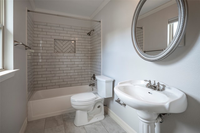 bathroom with toilet, crown molding, tiled shower / bath combo, and tile patterned floors