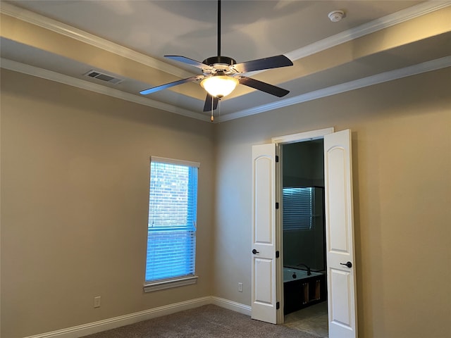 carpeted empty room with crown molding and ceiling fan