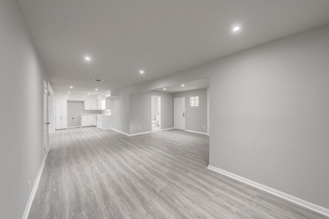 unfurnished living room featuring light hardwood / wood-style flooring