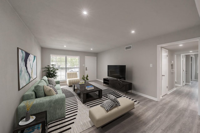 living room with light hardwood / wood-style floors